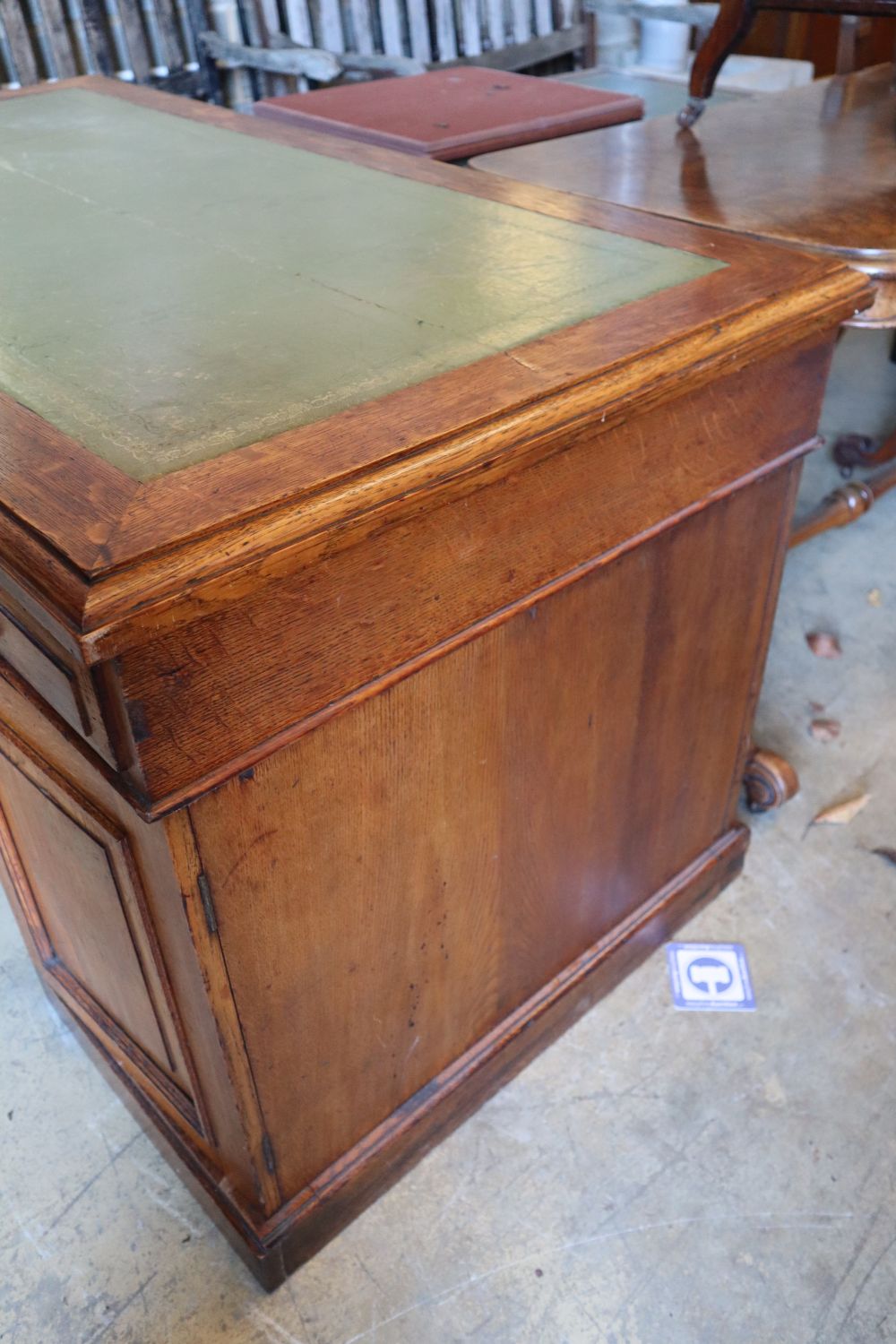 An early 20th century oak pedestal desk, width 136cm